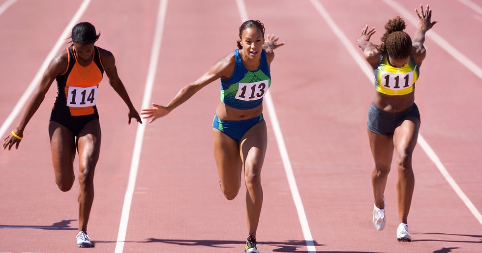 Athletes sprinting to the finish line