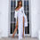 Miniaturbild: Model in white high-slit maxi dress