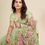 Thumbnail: Woman wearing a green saree, posing for a picture, Shopizo