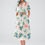 Miniature : Woman in palm tree print midi dress