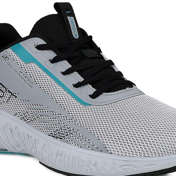 Thumbnail: Gray athletic shoe with black laces and teal accents, and the word SHOP