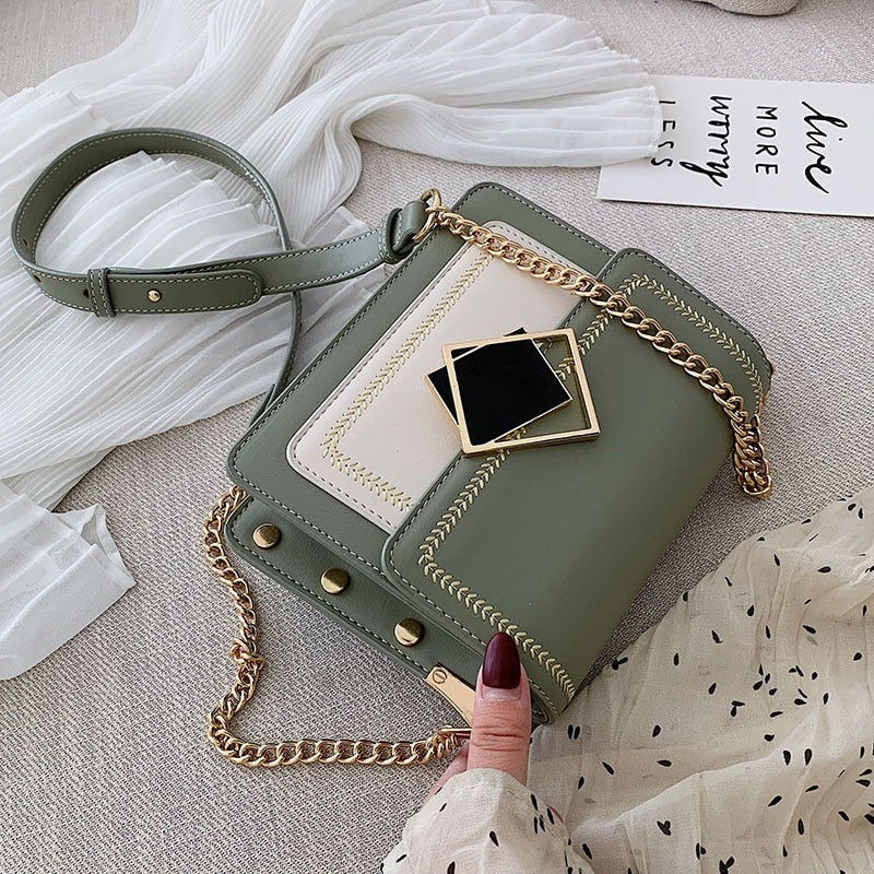 Elegant green and cream shoulder bag with gold chain