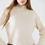 Thumbnail: Cream ribbed turtleneck sweater