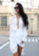 Woman in white cinched shirt dress