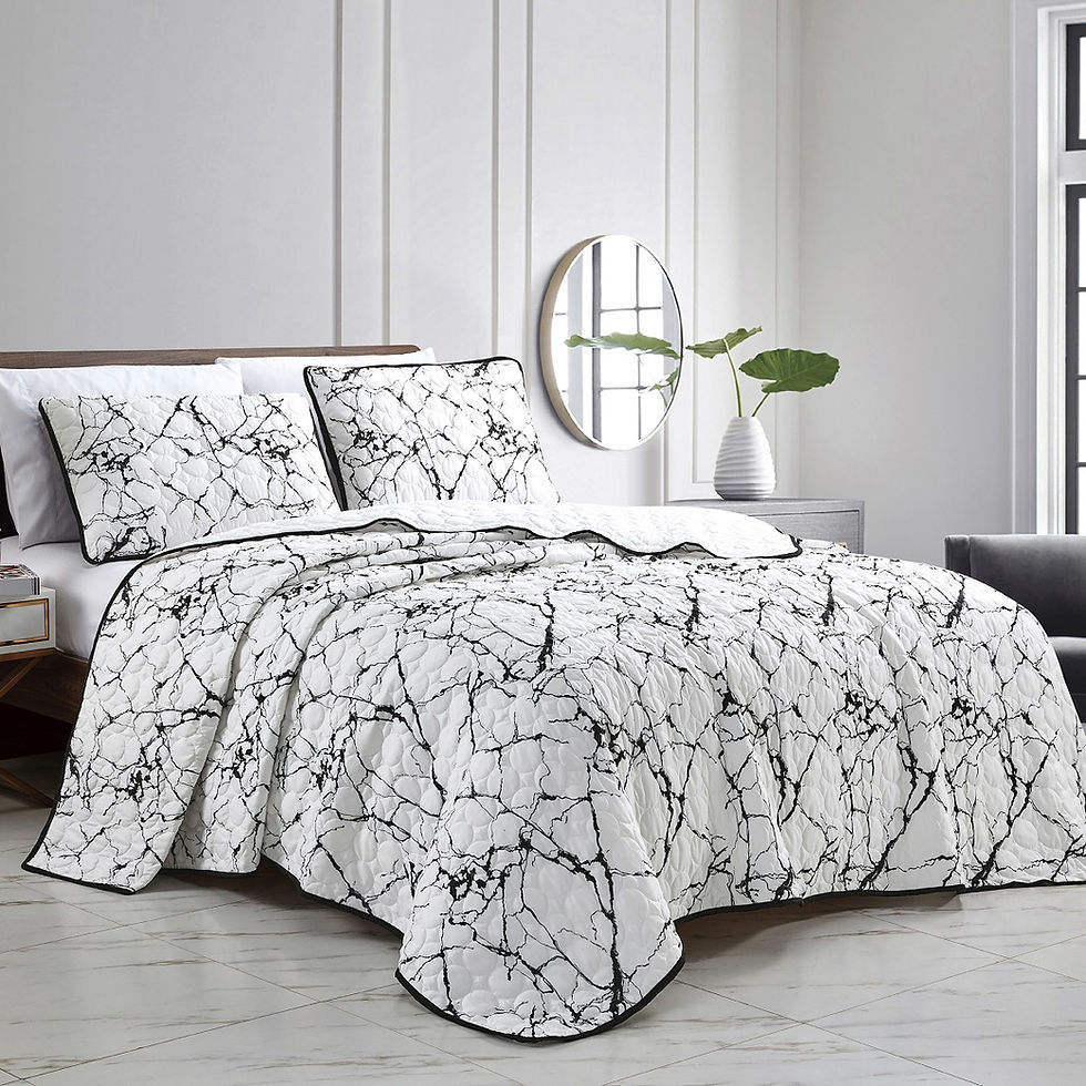 Black and white marble quilt set on bed