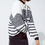 Miniature : Woman in black and white striped sweater