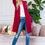 Miniature : Woman in maroon cardigan and jeans