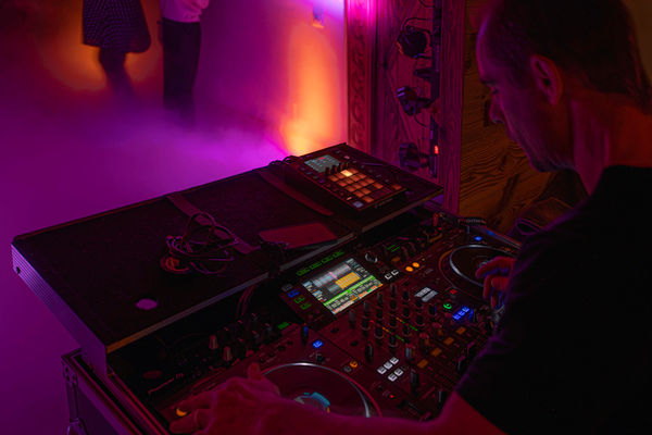 Mixing console and DJ at a private party in a luxury chalet near Megève.