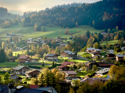 The village of Cordon in Haute-Savoie, at sunrise. The warm light of the golden hour in spring