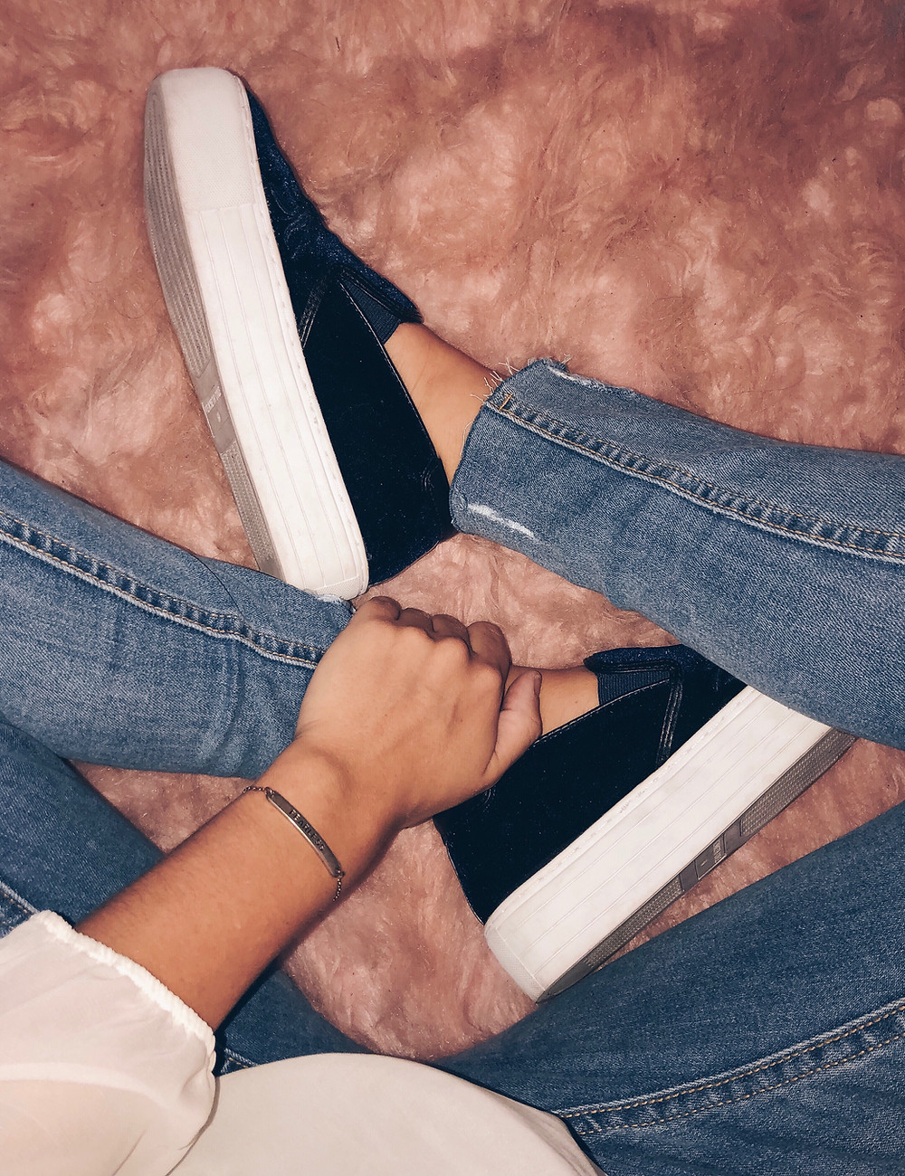 platform sneakers and blue jeans