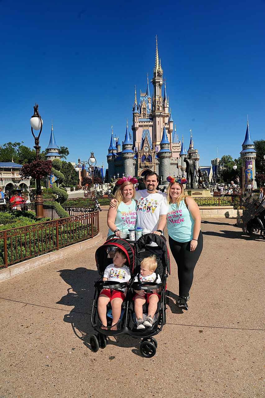 Travel Agent Cassie Daniels in front of Cinderella's castle