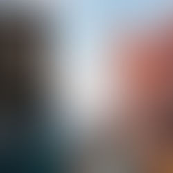 Dragonborn character in armor holding an axe, set against a mountainous backdrop. The screen displays different fantasy race options.