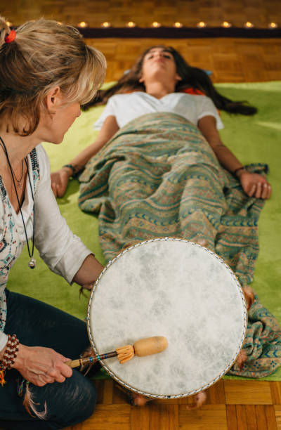 woman drumming around a female