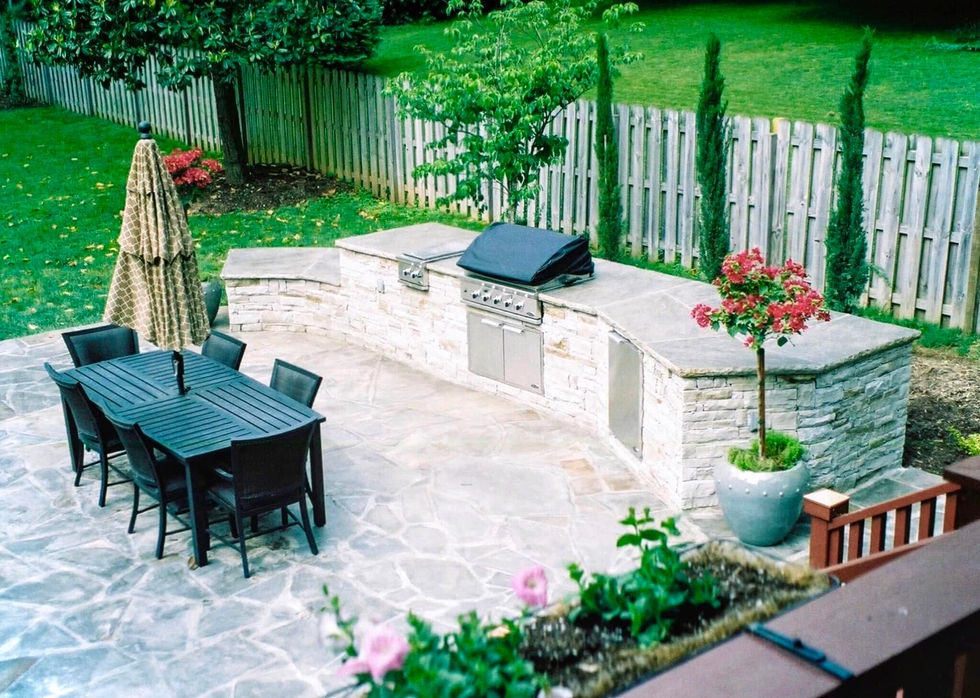 Outdoor kitchen built with natural stone both on top and around