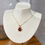 Thumbnail: Small Sunburst Necklace - 18k Gold and Pink Sapphire