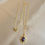 Thumbnail: Small Sunburst Necklace - 18k Gold and Pink Sapphire