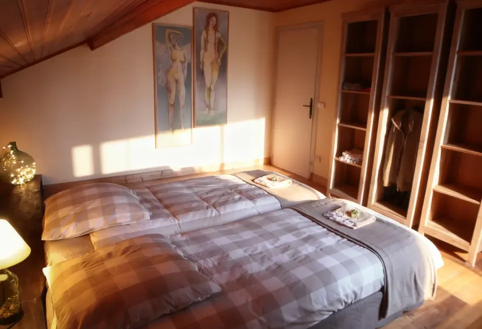 Double bedroom with light coming in through the window