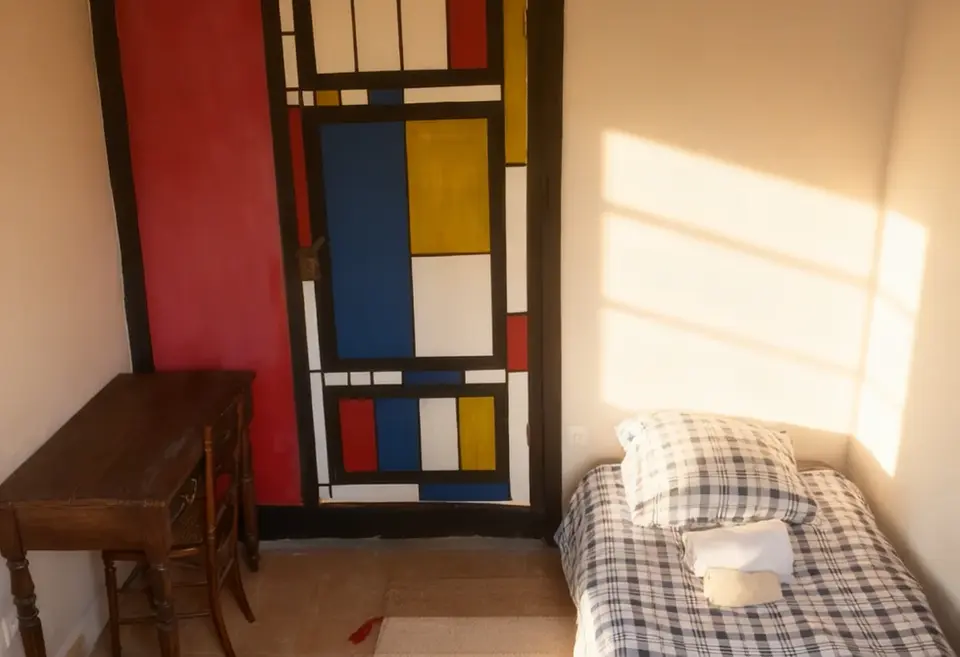 Single bedroom with painting on door