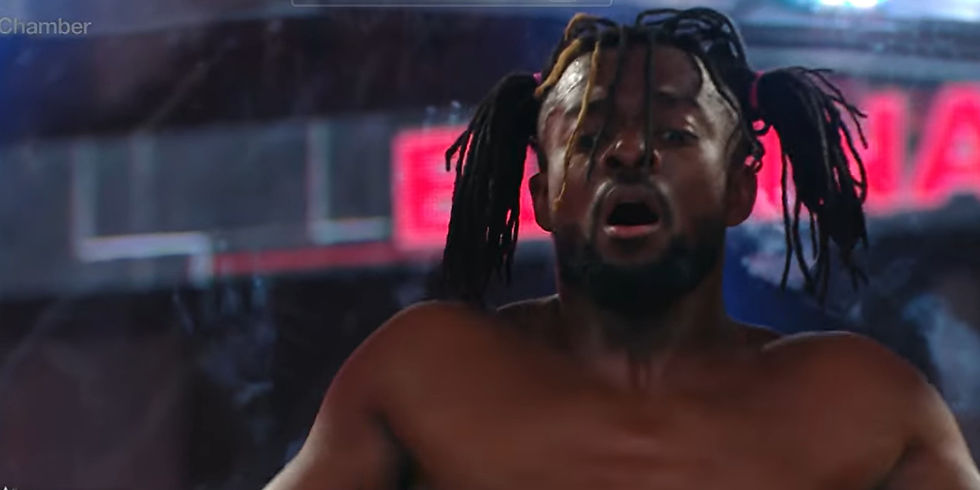 Kofi preparing to dive off an Elimination Chamber pod in 2019