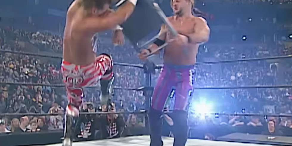 chris jericho delivers a chair shot to shawn michaels at wwe royal rumble 2003