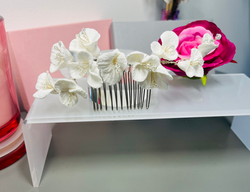 Floral bridal hair comb, delicately designed with soft ivory blossoms and subtle gold detail £30