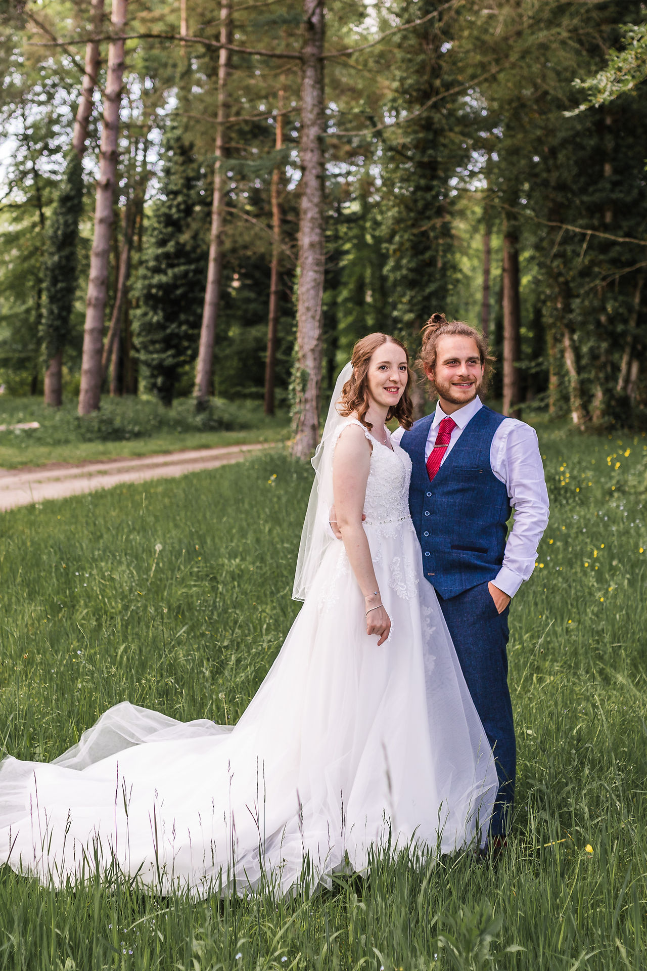 Portrait full length photo of bride and groom looking off into the distance at Stourton Estates Wedding in Lincolnshire