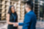 optimistic-businesswoman-shaking-hands-making-deal-2025-03-25-16-15-49-utc.jpg
