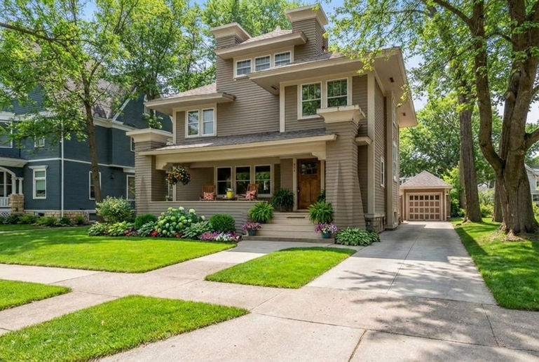 Large family home exterior real estate listing image after it was virtually redesigned.