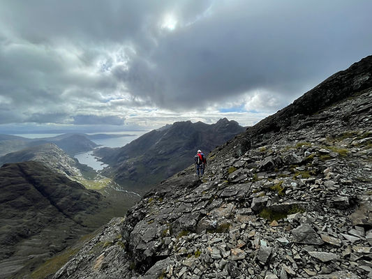 Traversing the Cuillin Ridge. Loch Courisk in the background
