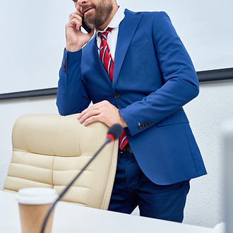 Public-figure-speaking-by-phone-603850.j