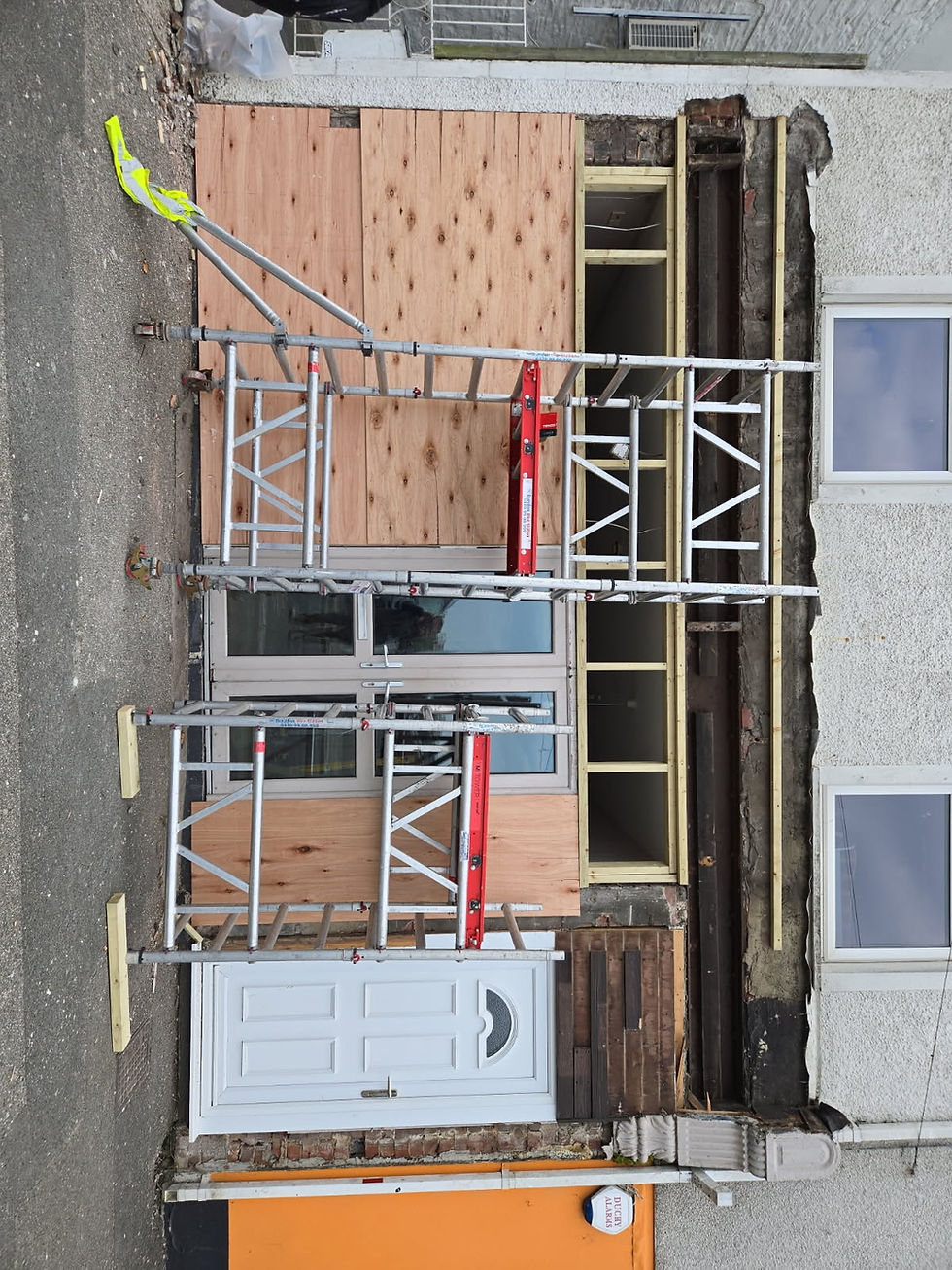 Shop renovations Cornwall with scaffolding and boarding.