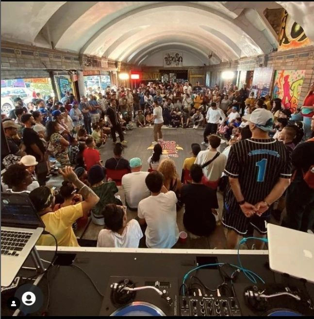 The vibrant Bronxlandia Block Party atmosphere with food and music.