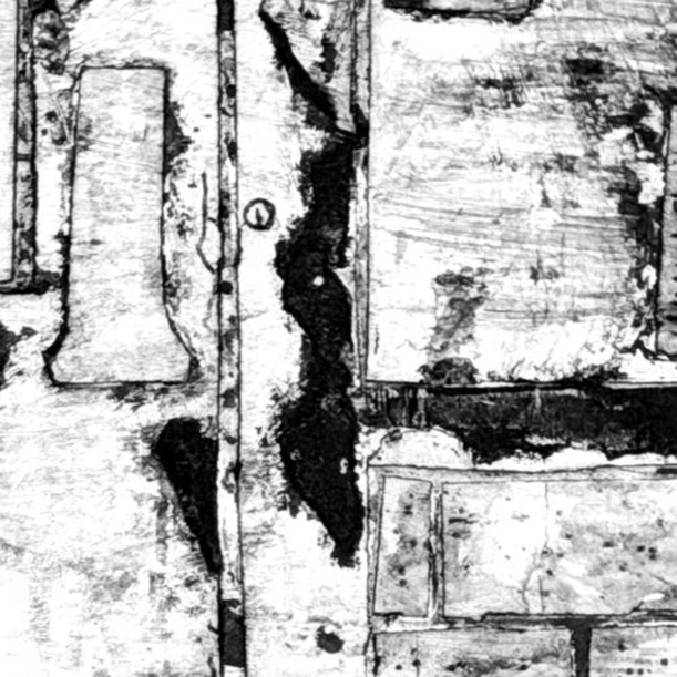 Zoomed in version of the highly textured gray and black print of the C4C form door in a cinder block wall with a window