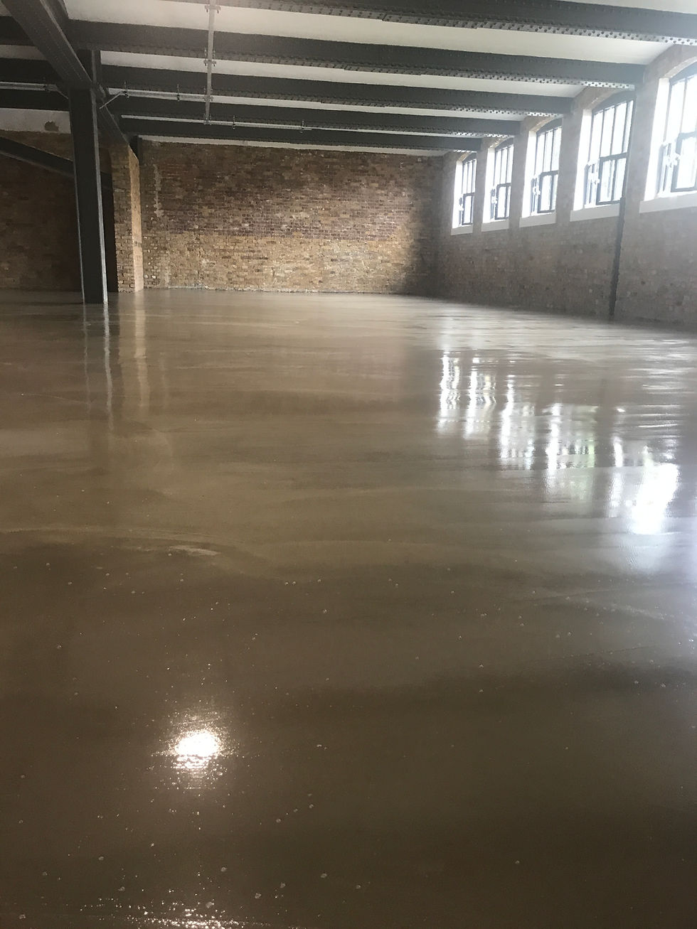 Hard wearing cement latex floor for property maintenance services.
