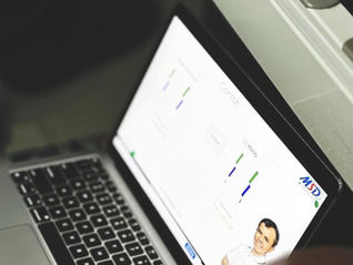 Online learning on a laptop representing the Upskillist free-month offer