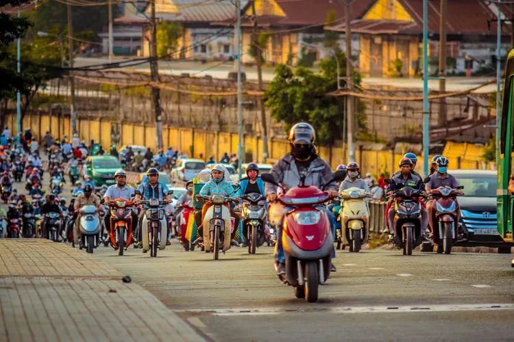 Busy streets of Southeast Asia filled with motorcycles and vibrant city life.
