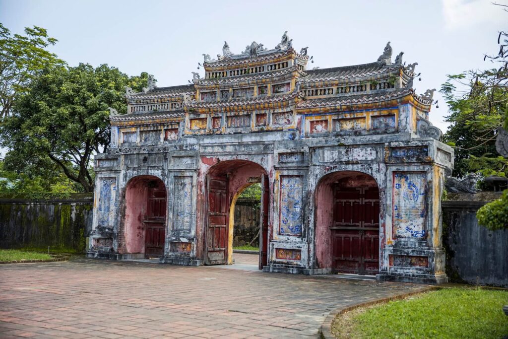 As you explore the ornate palaces, temples, and gardens within the complex, you’ll be transported back in time to the days of the Nguyen Dynasty.