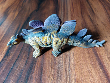 Wisdom Writing with a Toy Dinosaur