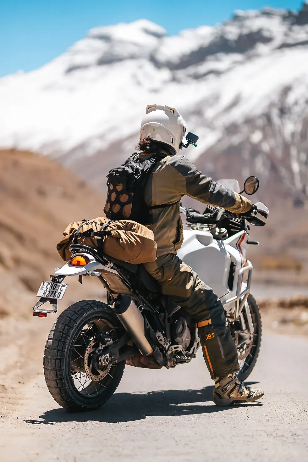 Close-up view of waterproof Kriega motorcycle bag with rain droplets