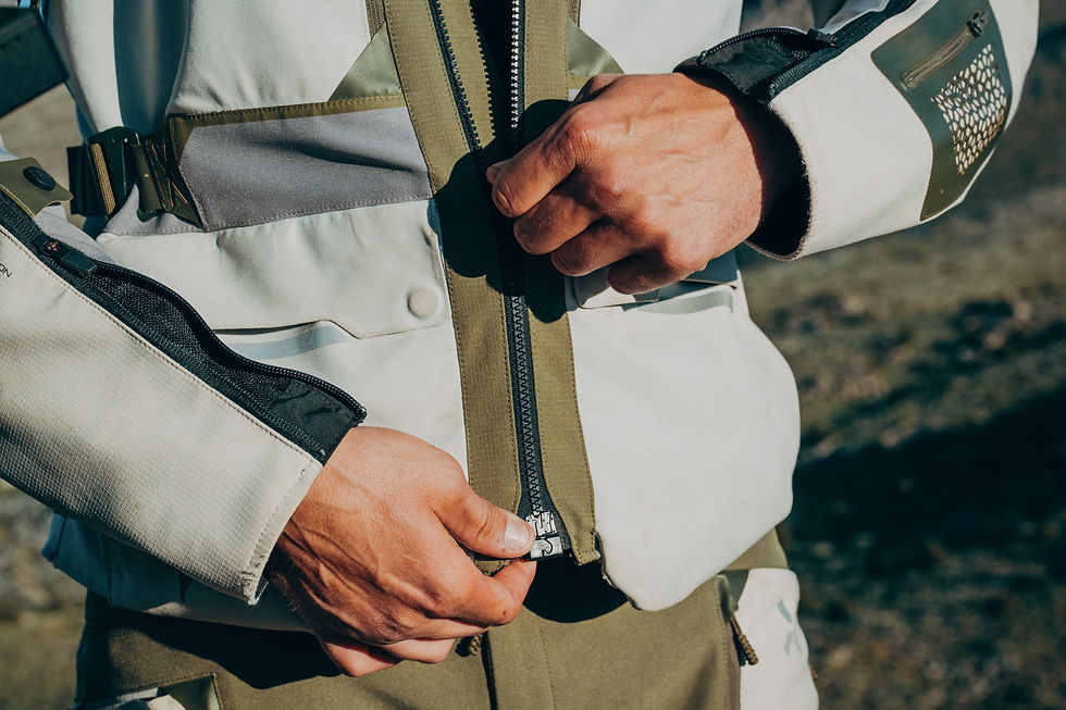 Close-up view of waterproof motorcycle jacket hanging on rack