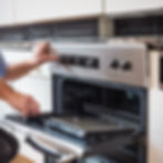 electrician installing oven