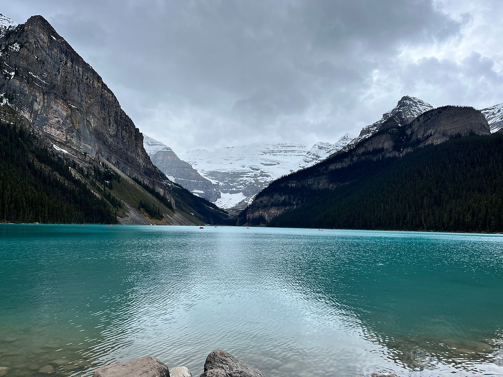 Deep blue Lake Louise in the backdrop of the glacier