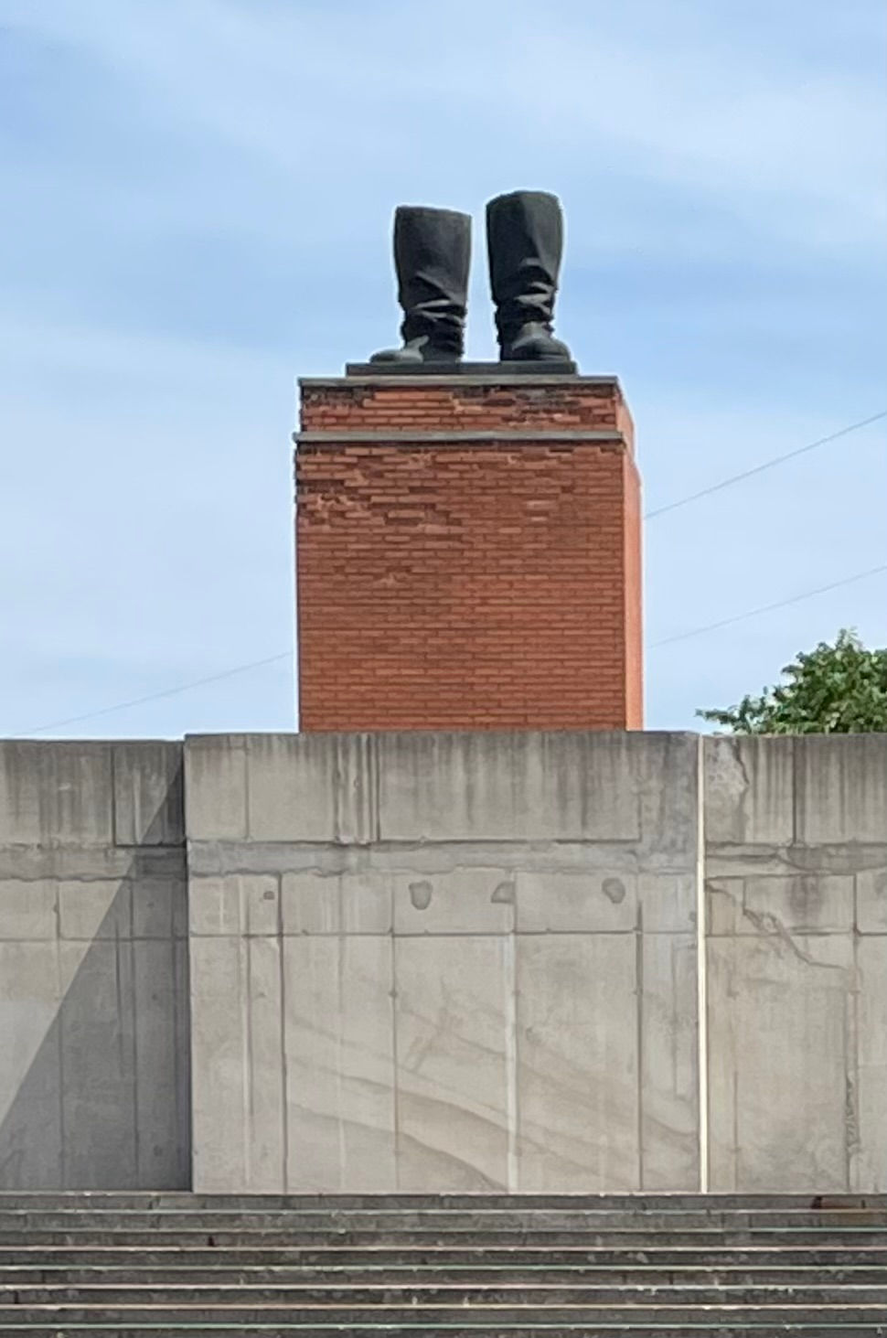 Stalin's boots stand on plinth at Memento Park Budapest
