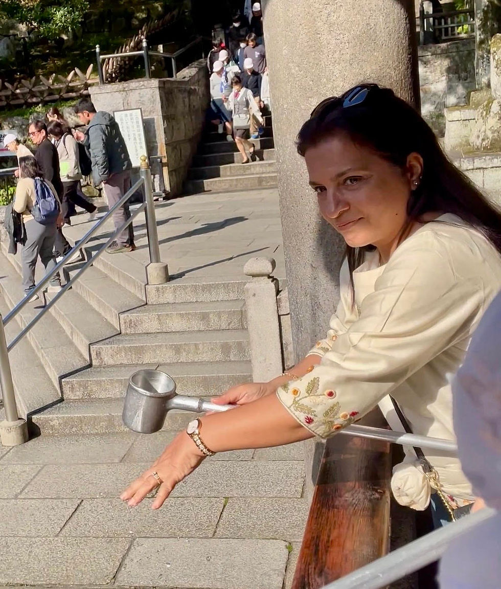 Drinking the sacred water at Kiyomizu-dera Temple Kyoto