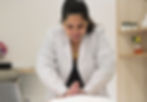 A trained osteopath using gentle visceral manipulation techniques to restore mobility of internal organs and support overall body balance and healing.