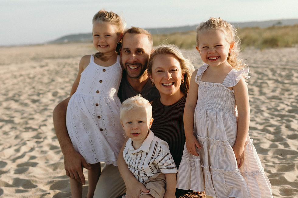 Family picture of the owner, Jordan, and her husband and three children.