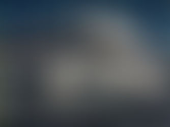 A two story building with turrets, an upstairs porch and a sign that reads sociedad de cuba on the front.