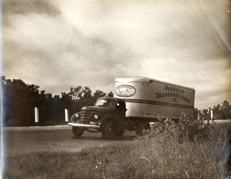 A truck with Overseas Transportation written on the side
