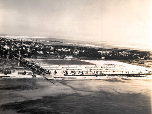 Aerial view of a large building on a shoreline