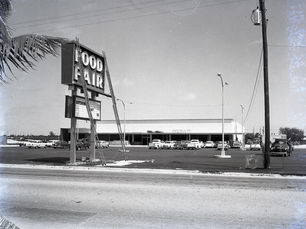 A store with a sign out front that reads Food Fair.